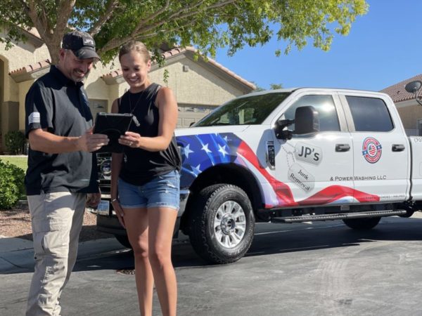 Las Vegas junk removal professional interacting with a client
