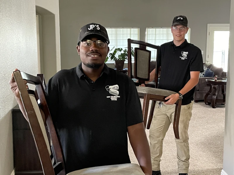 JP Junk Removal team carrying out furniture