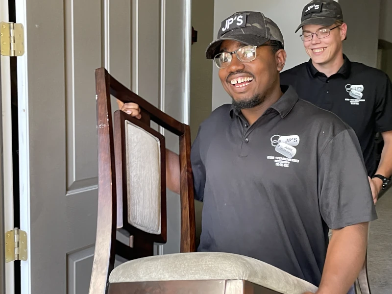 JP Junk Removal team carrying out furniture