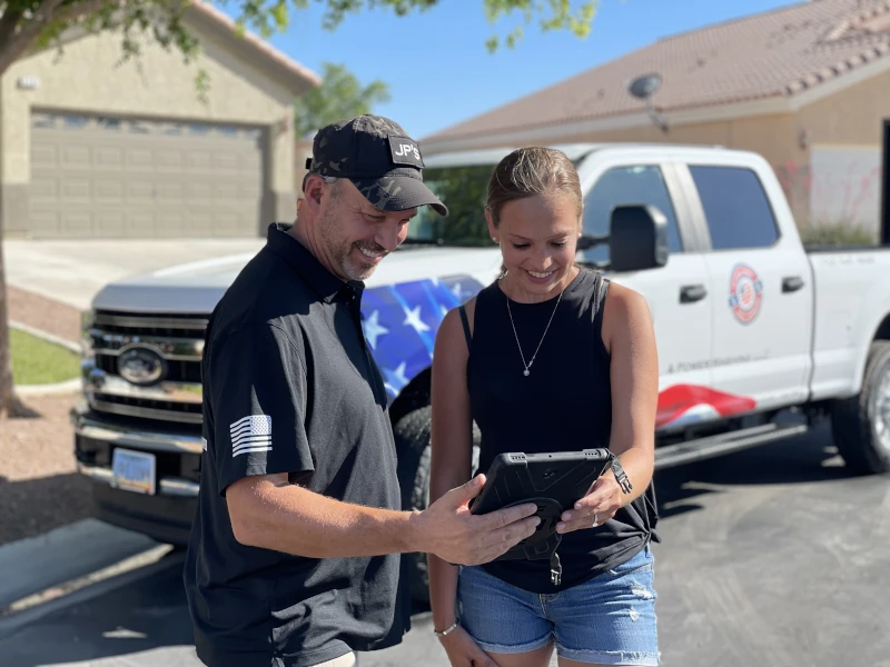 jp's junk removal crew discussing services with the client