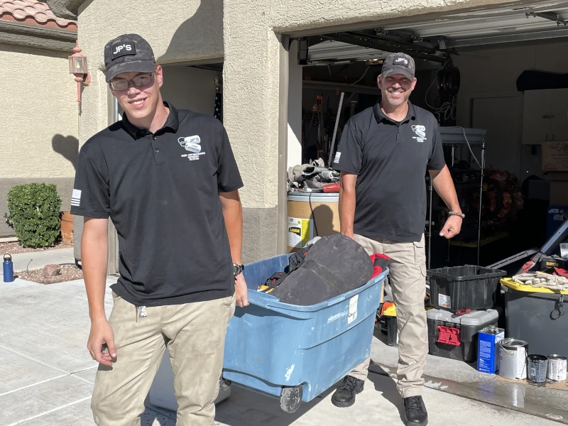 jp's junk removal team hauling junk